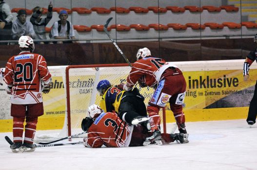 ZELL AM SEE; AUSTRIA - AUG 30: Austrian National League. Players of KAC II are protecting their goalie. Game EK Zell am See vs KAC II (Result 2-3) on August 30, 2011 in Zell am See.