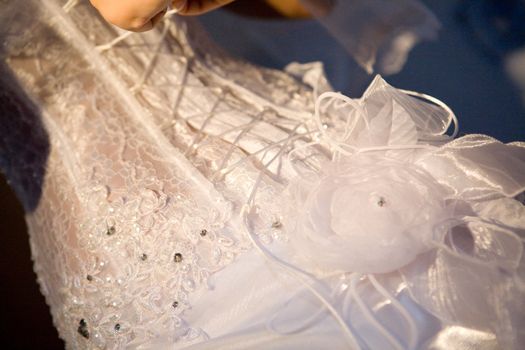 back of a wedding dress with artificial flowers