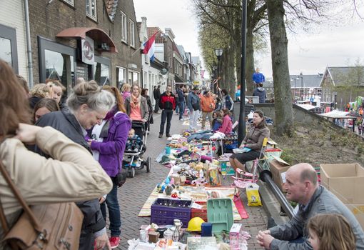 MELISSANT,HOLLAND - APRIL 30 unidentified people shopping on the market in the streets during the celebration of queensday on April 30, 2013 in Melissant, The Netherlands