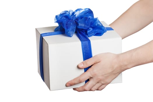 Human hand holding blue ribbon wrapped holiday surprise gift or present box package