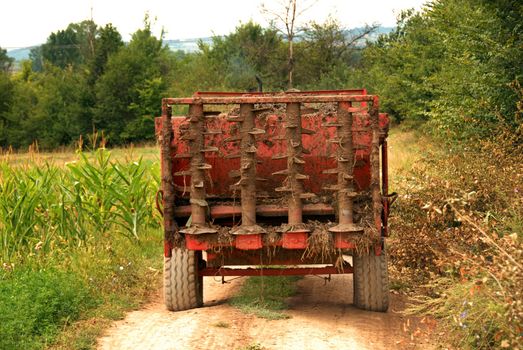tractor with agricultural machine on rural road in Serbia