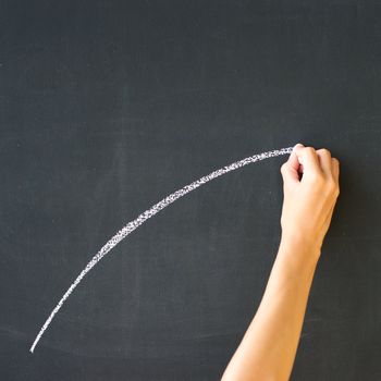 Hand drawing on a blackboard