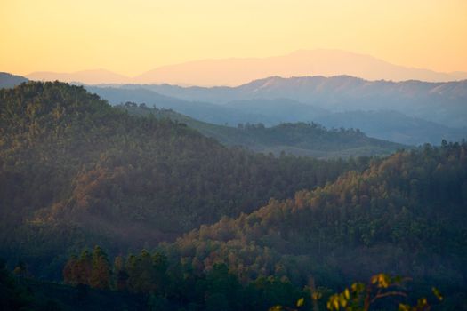 Mist in the mountains at sunset in northern Thailand