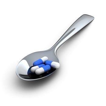 Blue medical capsules in metal spoon