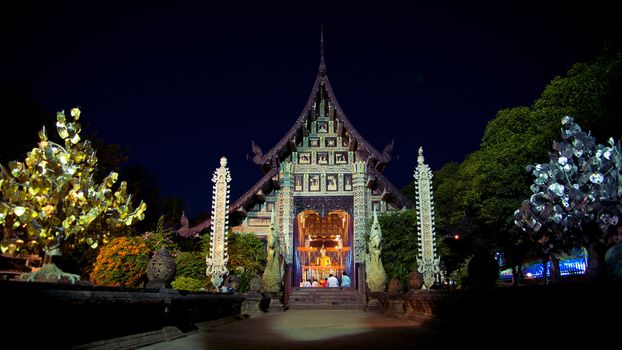 Night prayer at Lok Molee temple in Chiangmai, Thailand