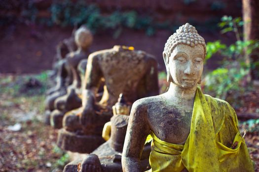 Old ruined buddhist statues in the ancient temple in Chiangmai, Thailand