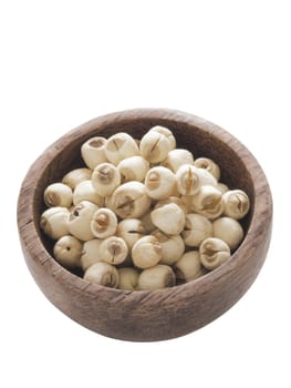 close up of a bowl of lotus seeds isolated on white