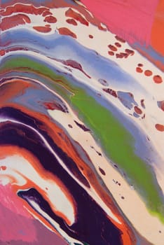 A bright, colorful abstract background created by wet paints mixing on a rotating canvas.