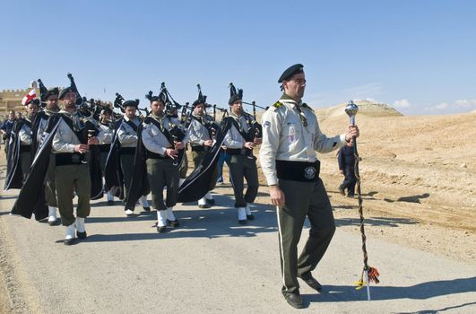 QASER EL YAHUD , ISRAEL - JAN 18 : Palestinian christian band participates in the baptising ritual during the epiphany at Qaser el yahud , Israel in January 18 2012