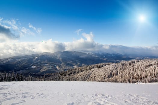 High mountain landscape with sun (alps in winter)