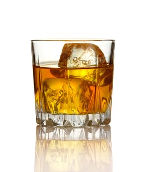 Glass of whiskey and ice isolated on white background