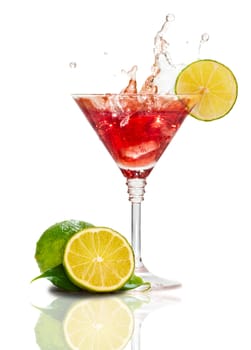 Red martini cocktail with splash and lime isolated on white 