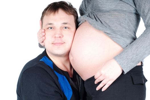 Shot of pregnant woman and her husband isolated on white