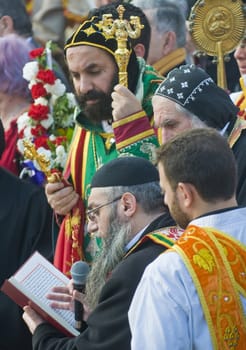 QASER EL YAHUD , ISRAEL - JAN 19 : Syrian Orthodox priests participates in the annual baptising ceremony during the epiphany at Qaser el yahud , Israel in January 19 2012