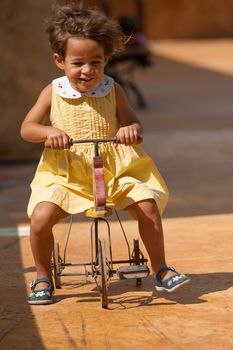 Girl proving that centenarian toys can be fun as well