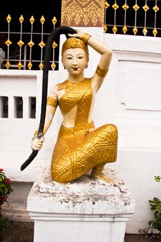 Statue of a woman with long hair.