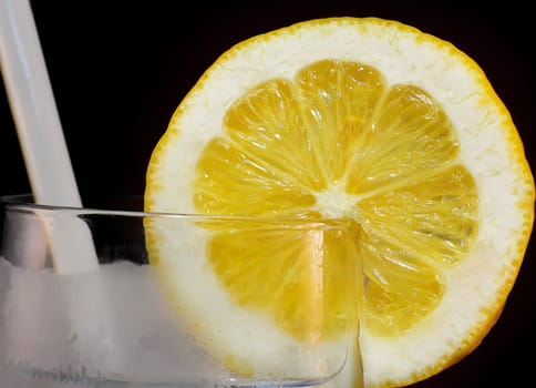 Lemon Slice in an Ice Filled Glass of Water