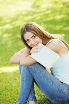 Young woman with book, copy space
