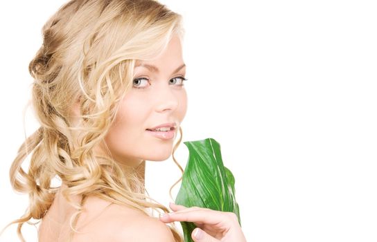 picture of woman with green leaf over white