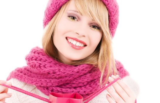 happy teenage girl in hat with pink shopping bag