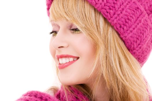 happy teenage girl in winter hat over white