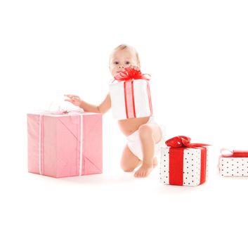 picture of baby boy with gifts over white