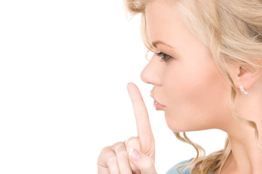 bright picture of young woman with finger on lips