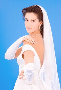 happy bride with her wedding ring over blue