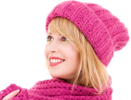 happy teenage girl in winter hat over white