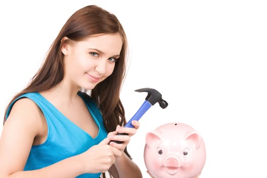 lovely teenage girl with piggy bank and hammer