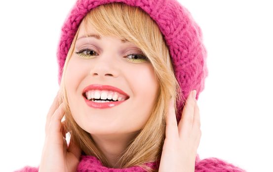 happy teenage girl in winter hat over white