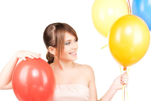 happy teenage girl with balloons over white