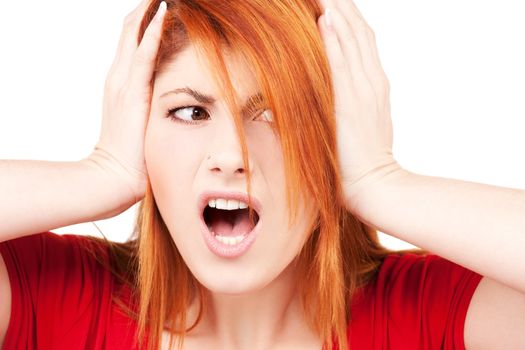 picture of unhappy redhead woman with hands on ears