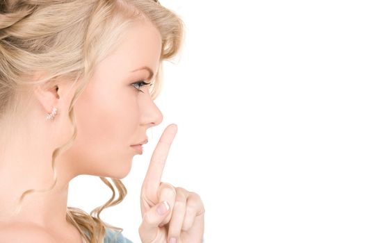 bright picture of young woman with finger on lips