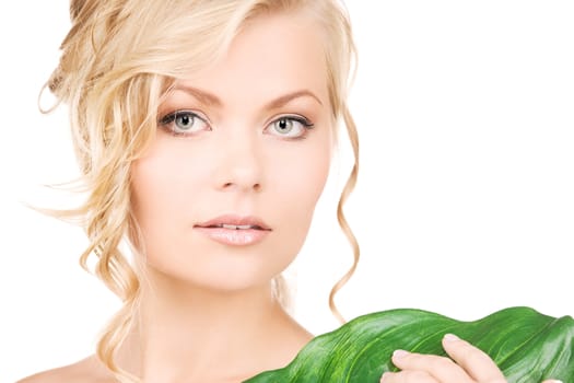 picture of woman with green leaf over white