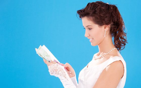 happy bride with calculator and money over blue