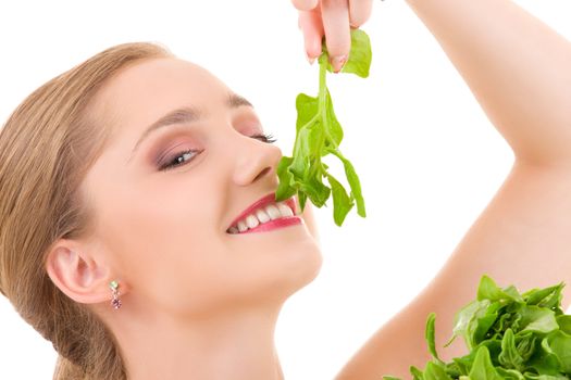 picture of happy woman with spinach over white