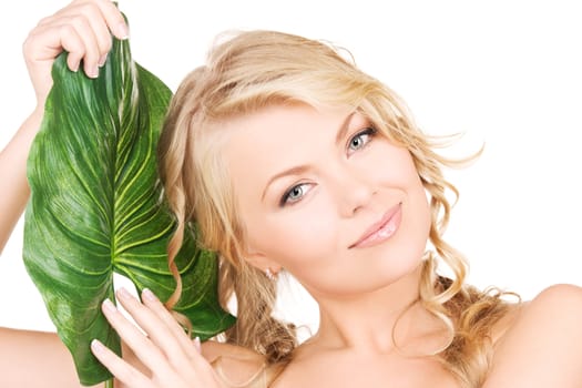 picture of woman with green leaf over white