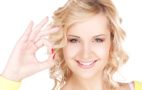 bright picture of lovely blonde showing ok sign