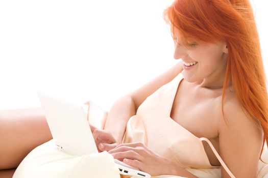 picture of happy redhead woman with laptop computer