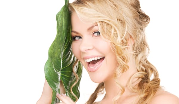 picture of woman with green leaf over white