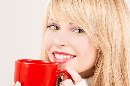 picture of happy teenage girl with red mug