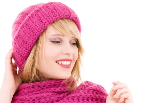 happy teenage girl in winter hat over white