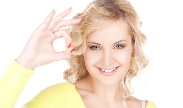 bright picture of lovely blonde showing ok sign