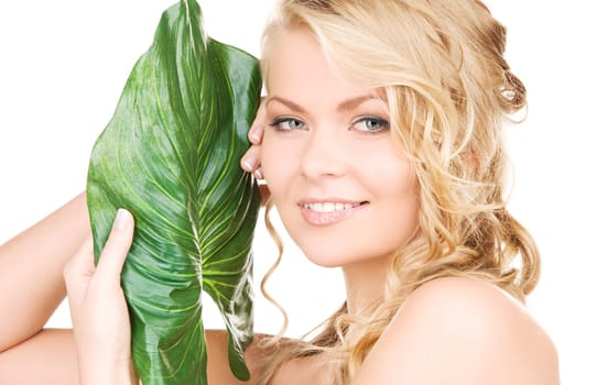 picture of woman with green leaf over white