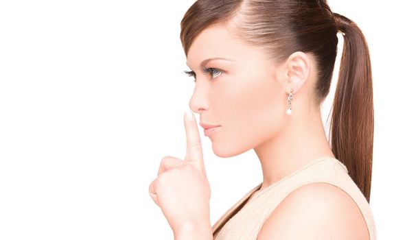 bright picture of young woman with finger on lips