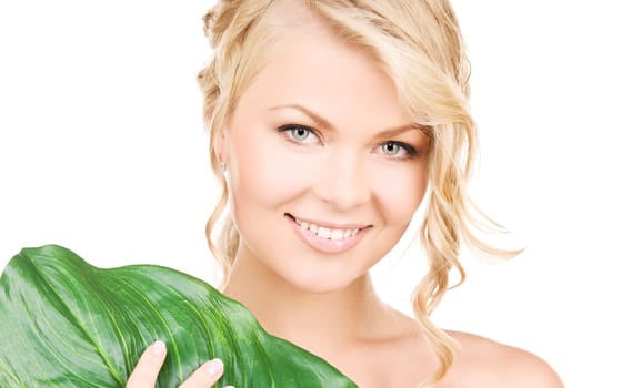 picture of woman with green leaf over white