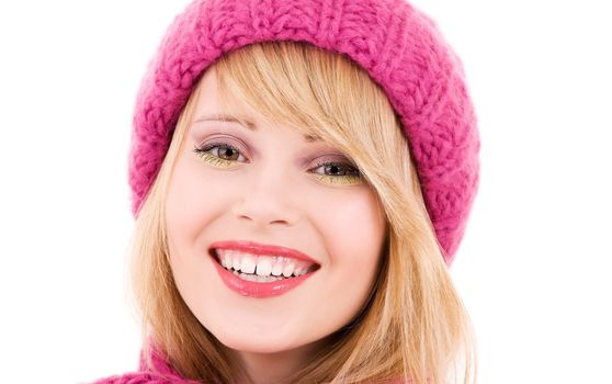 happy teenage girl in winter hat over white