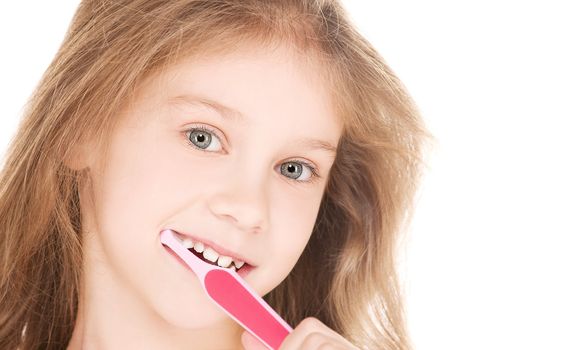 picture of happy girl with toothbrush over white