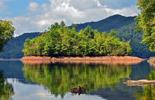 A beautiful lake in North Carolina with a reflection of the island.